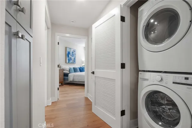a view of a bedroom with washer and dryer
