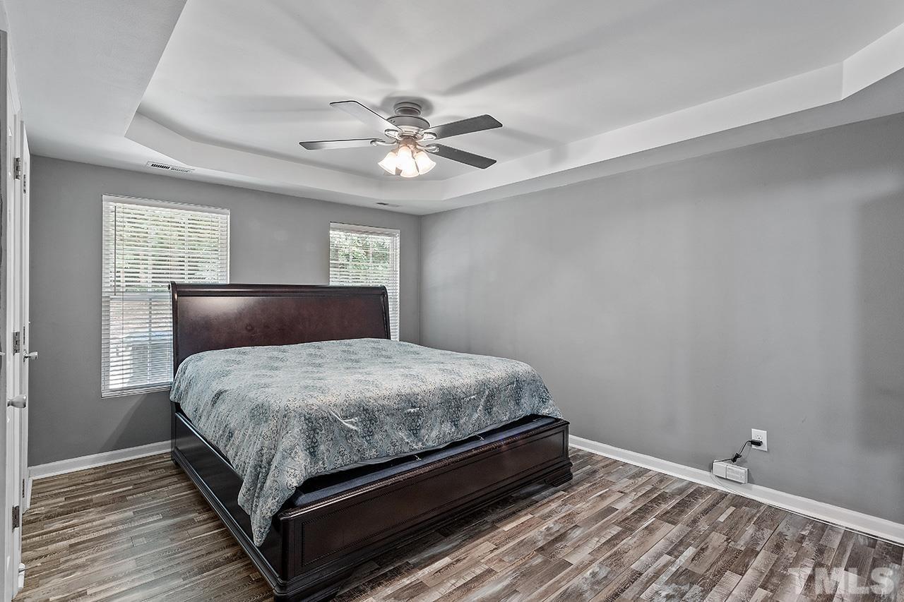 4236 Dalcross Road Raleigh, NC 27610 - Photo 9 of 14 a bedroom with a bed and window