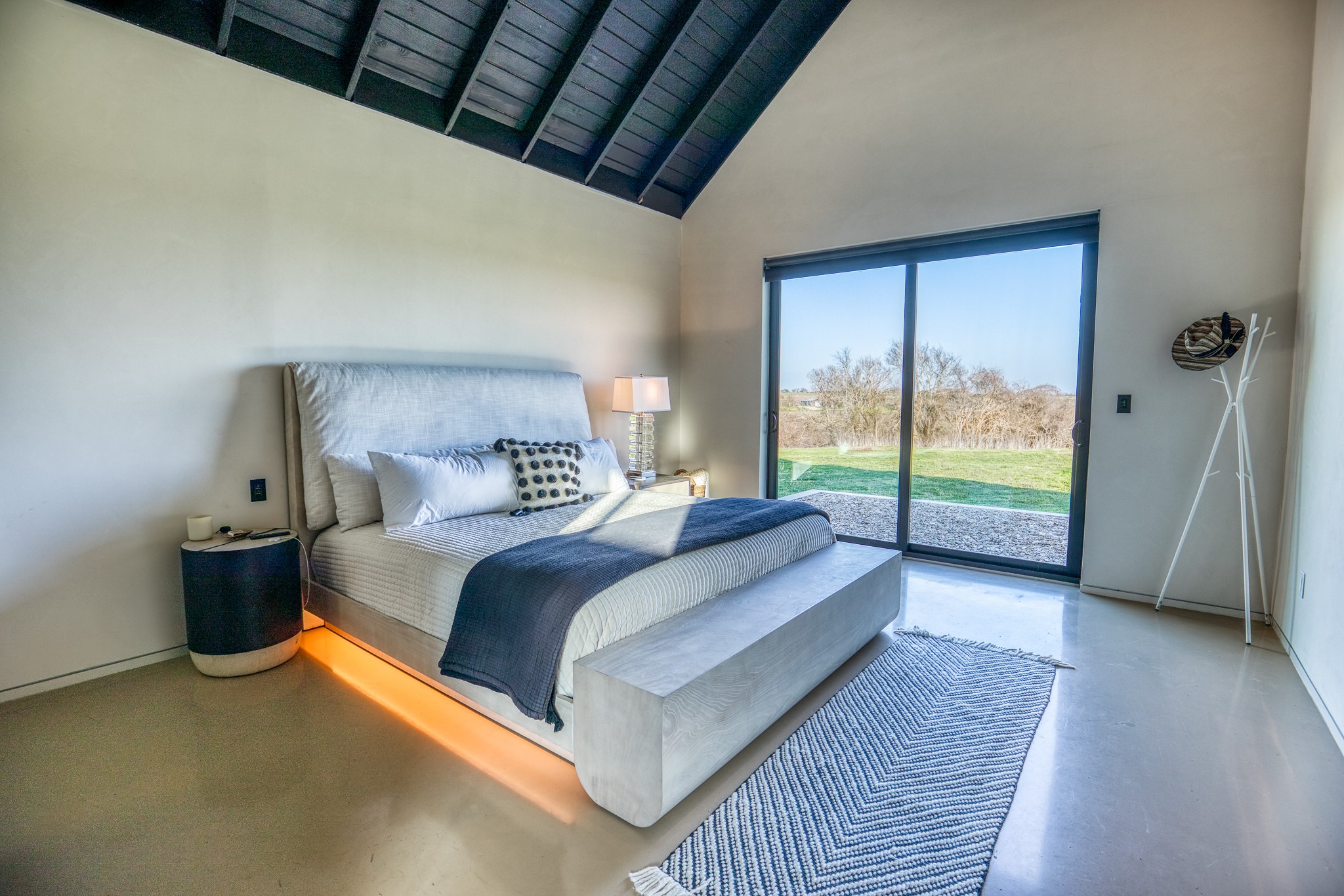 1905 Century Farms Road Burton, TX 77835 - Photo 7 of 29 a bedroom with a large bed and a large window