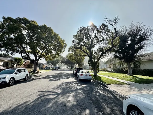 a view of street with parked cars