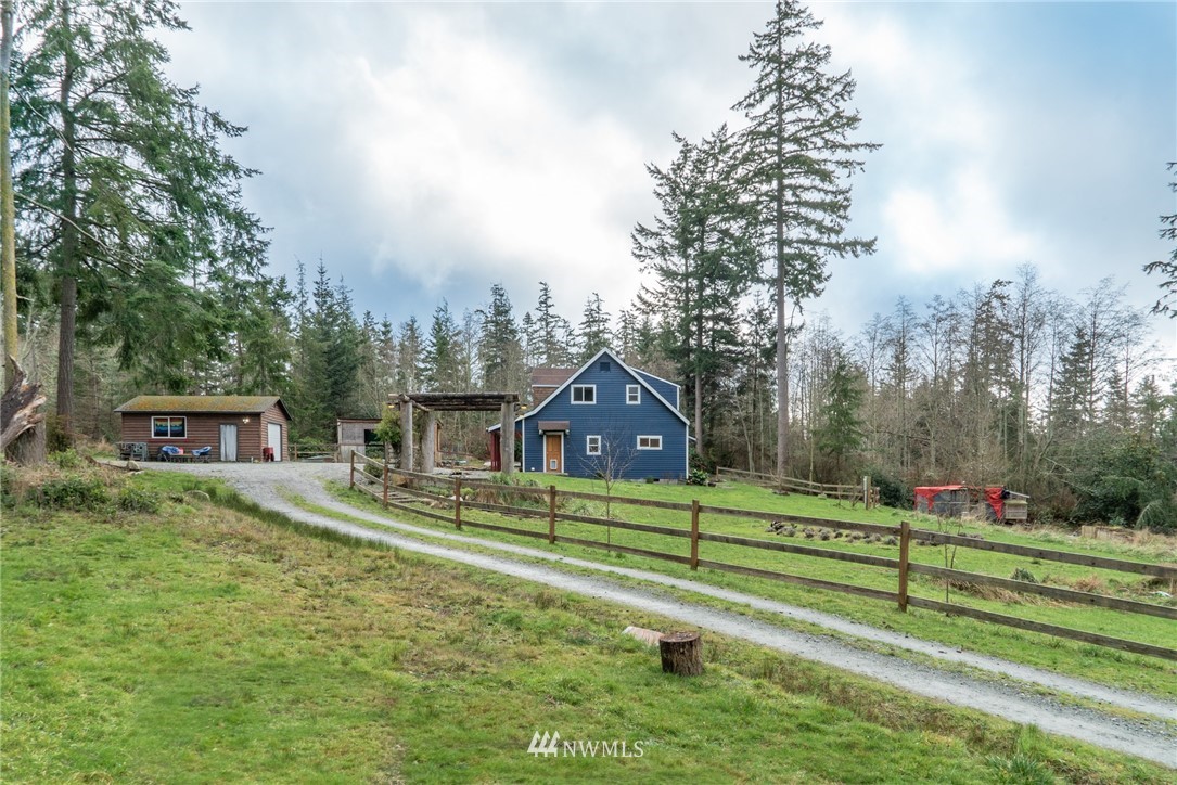 3399 East Harbor Road Langley, WA 98260 - Photo 11 of 36 a front view of a house with a small yard