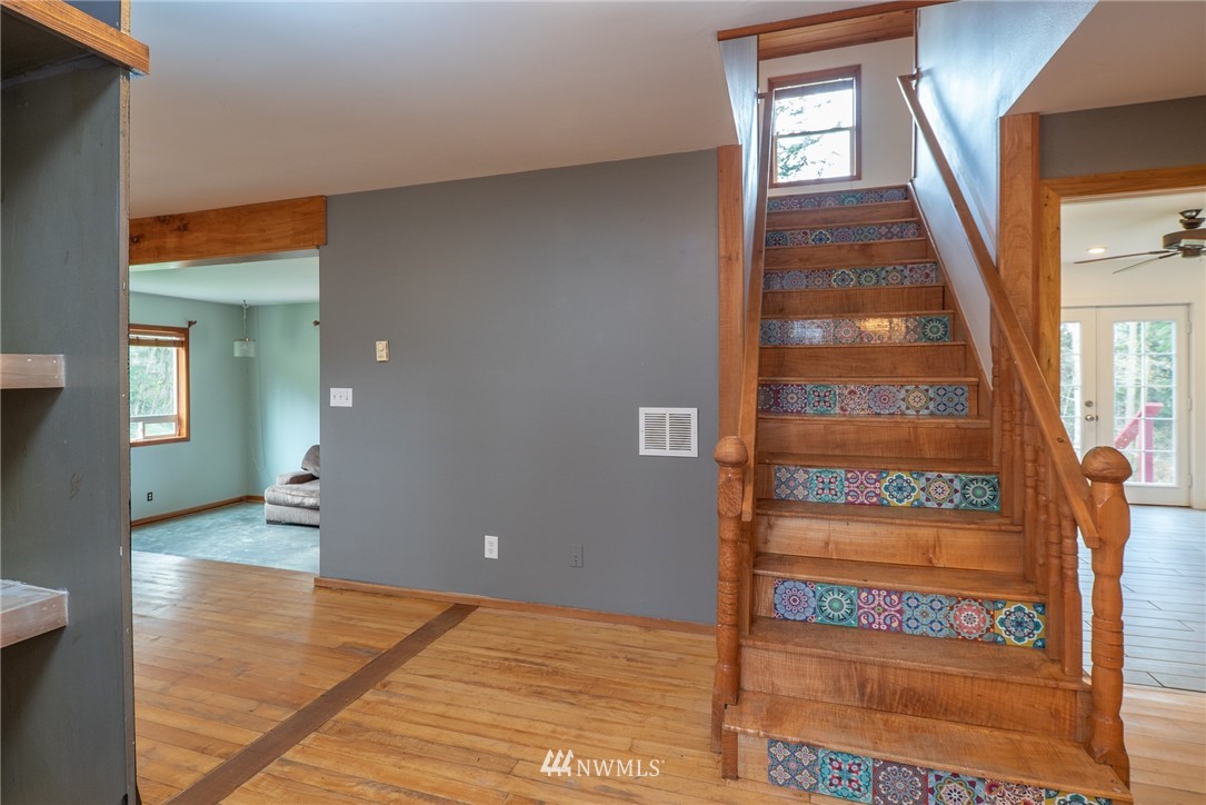3399 East Harbor Road Langley, WA 98260 - Photo 16 of 36 a view of an entryway with wooden floor