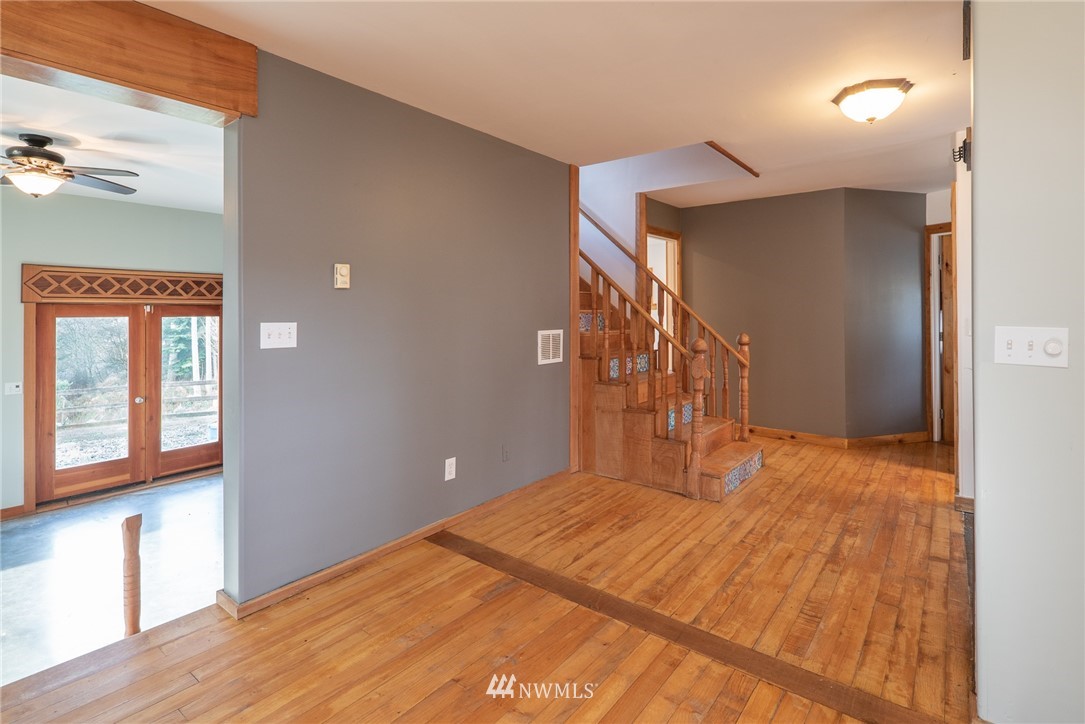 3399 East Harbor Road Langley, WA 98260 - Photo 19 of 36 a bedroom with a bed and a window