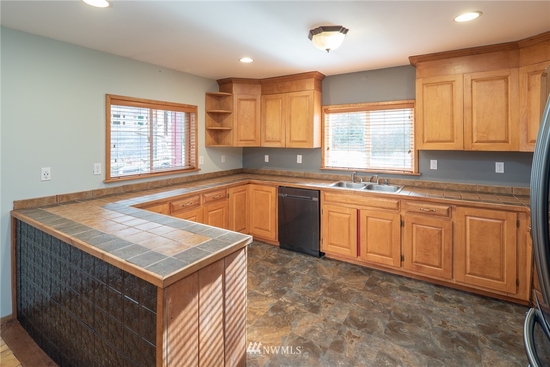 3399 East Harbor Road Langley, WA 98260 - Photo 21 of 36 a kitchen with a sink stove and window