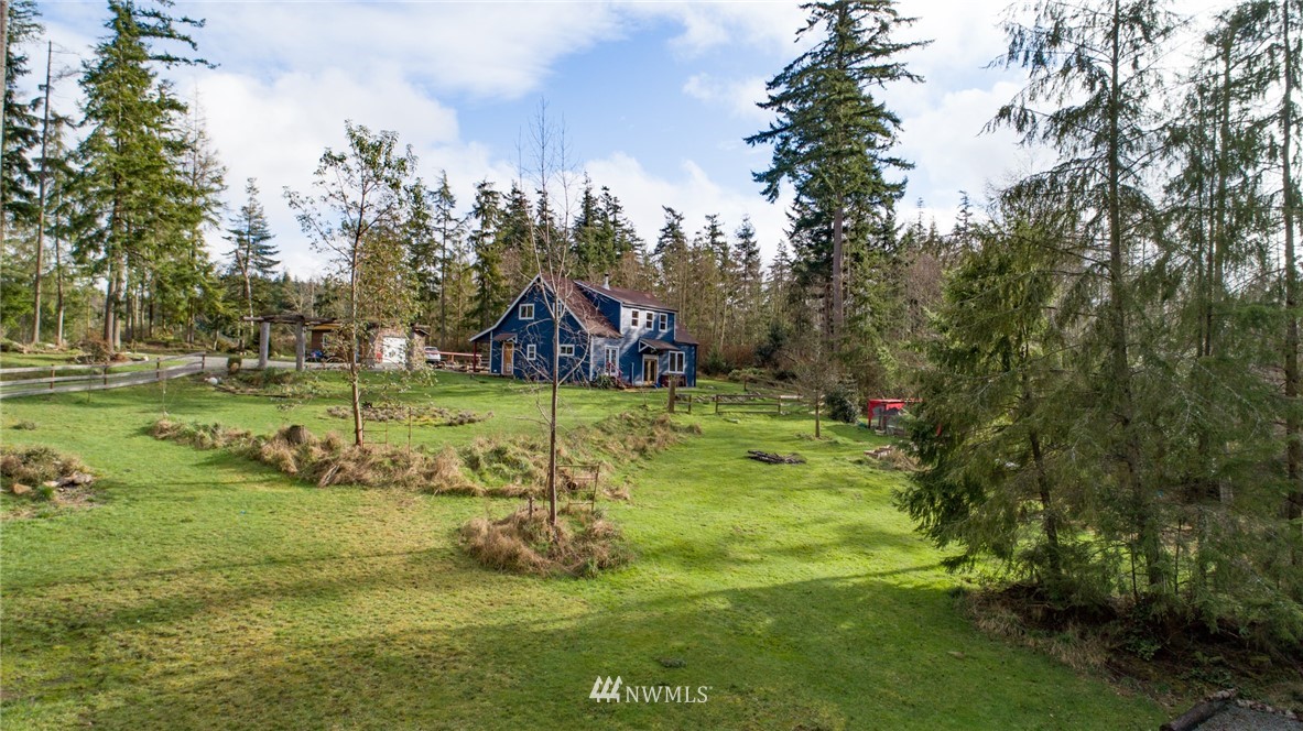 3399 East Harbor Road Langley, WA 98260 - Photo 4 of 36 a view of a garden with a bench
