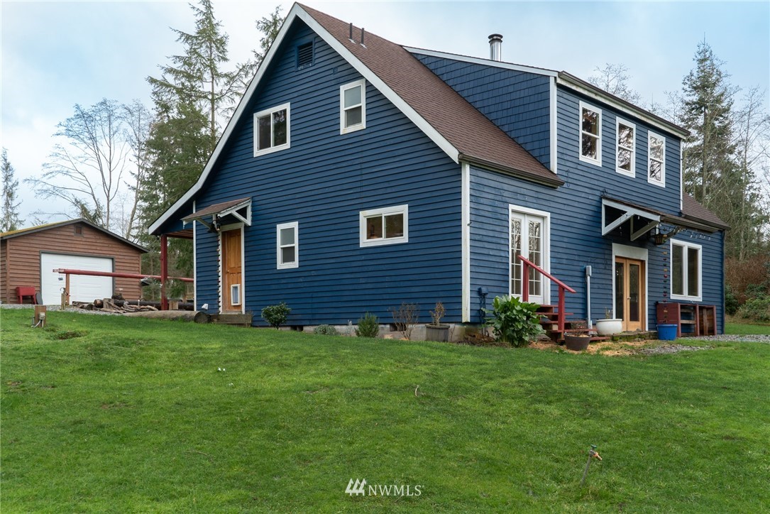3399 East Harbor Road Langley, WA 98260 - Photo 8 of 36 a front view of house with yard and green space