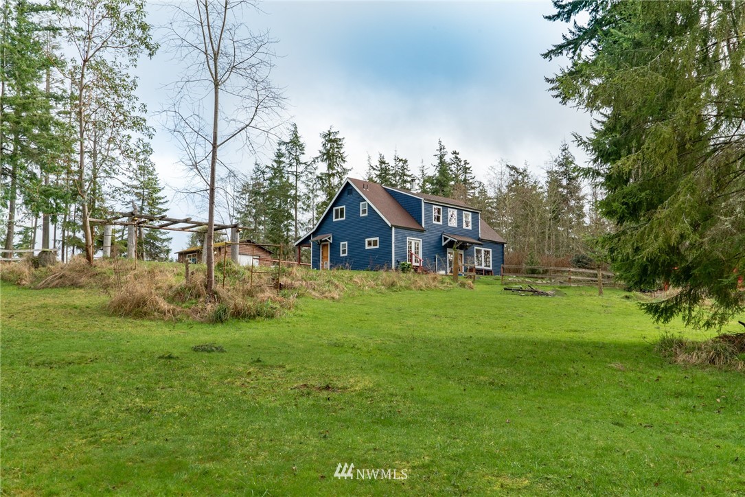 3399 East Harbor Road Langley, WA 98260 - Photo 9 of 36 a view of a house with a big yard
