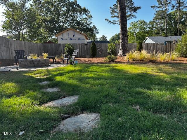 809 Trinity Park Drive Wake Forest, NC 27587 - Photo 2 of 3 a view of a table and chairs in patio with wooden fence