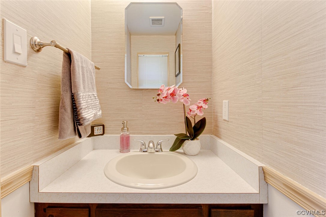 2125 Briarcliff Road Richmond, VA 23225 - Photo 19 of 27 Bathroom with large vanity, tile walls, and mirror