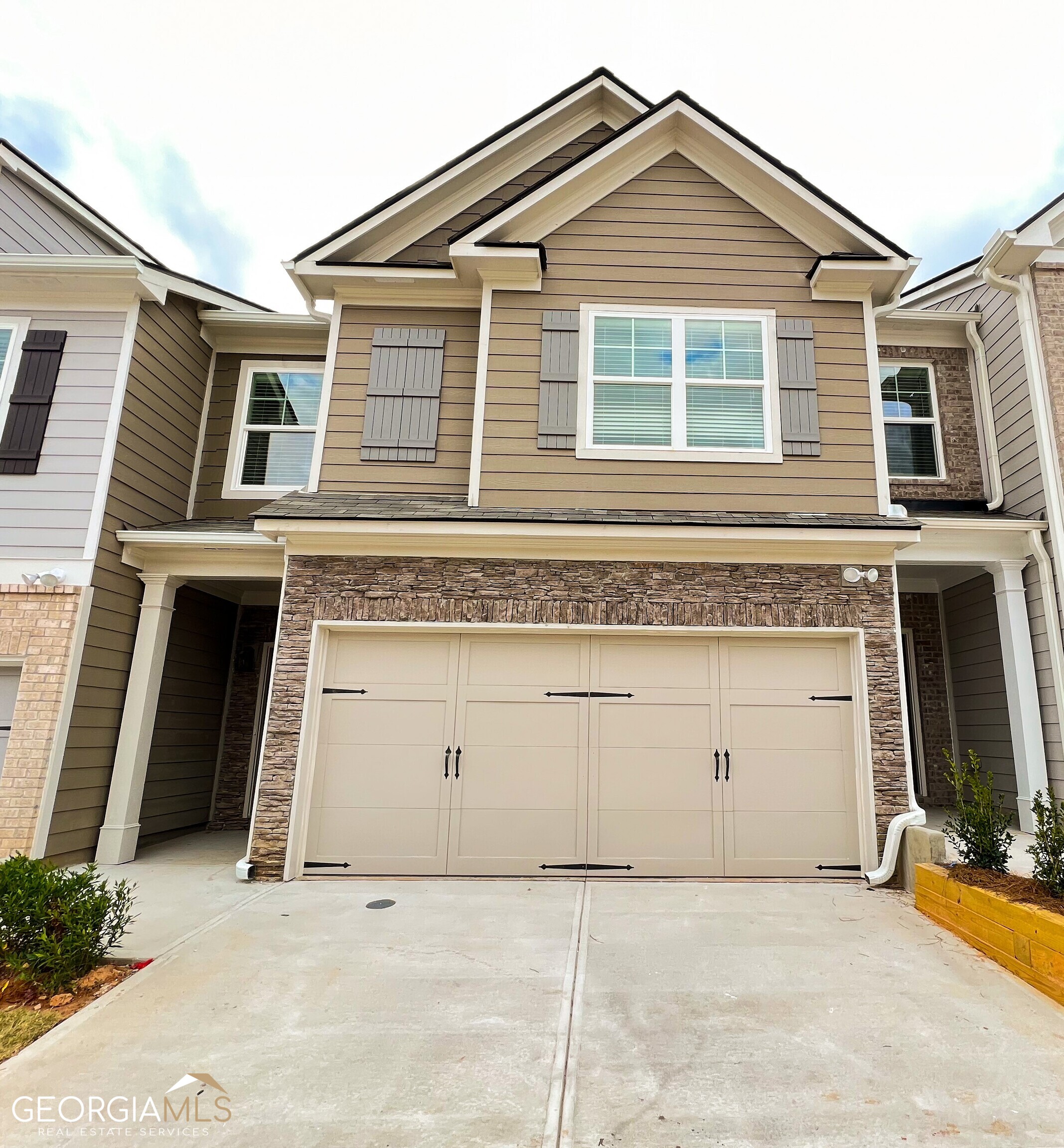 7719 Baron Road, Unit 368 Fairburn, GA 30213 - Photo 1 of 1 a view of a house with windows