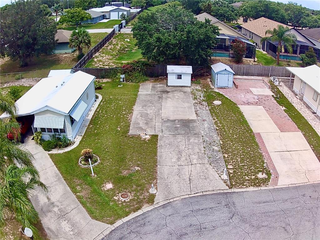 332 Canna Lane, Unit 146 Davenport, FL 33837 - Photo 3 of 3 an aerial view of a house with garden space and street view