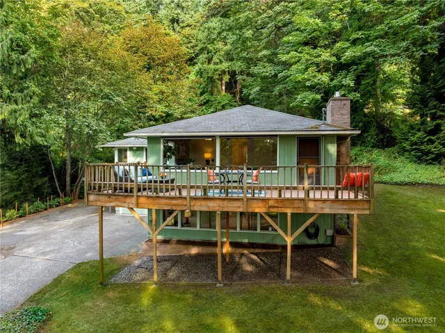 a view of a chair and table on the garden