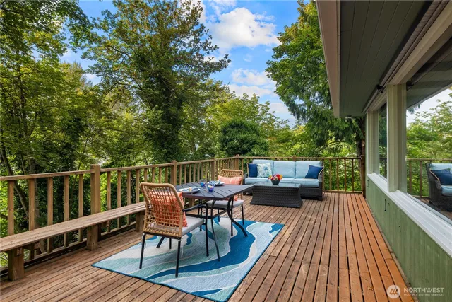 a view of balcony with furniture and wooden floor