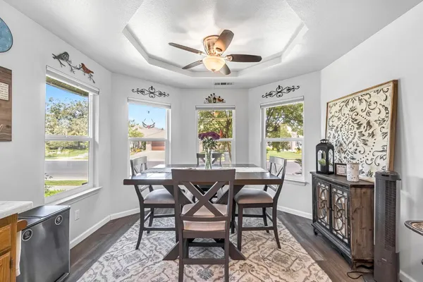 a view of a dining room with furniture window and outside view
