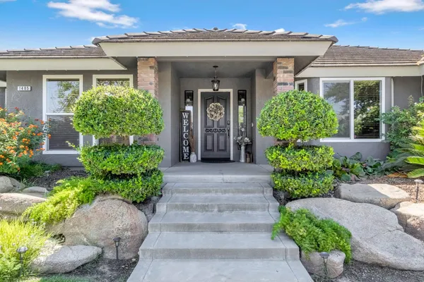 front view of the house with potted plants