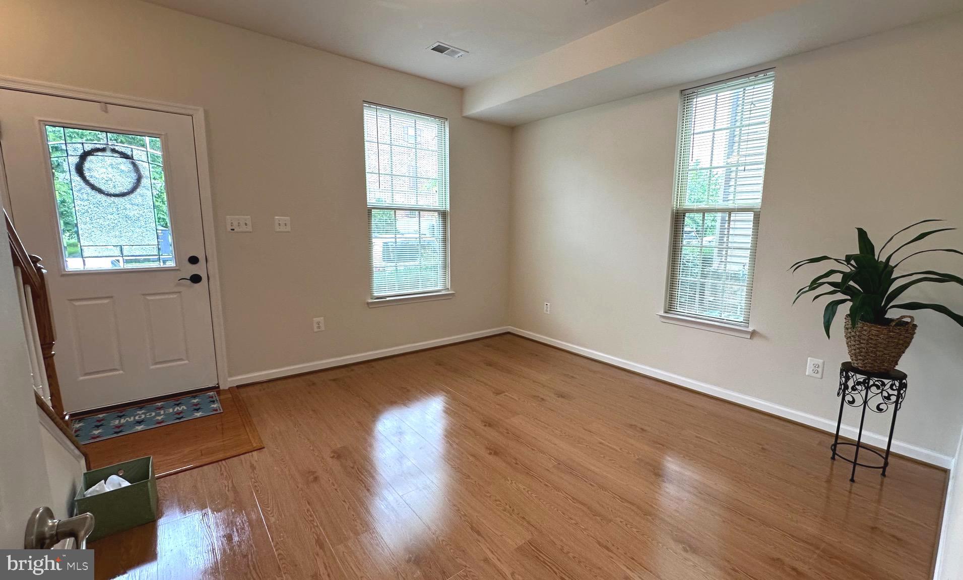 7343 Old Calvary Road Hanover, MD 21076 - Photo 7 of 35 an empty room with wooden floor closet and windows