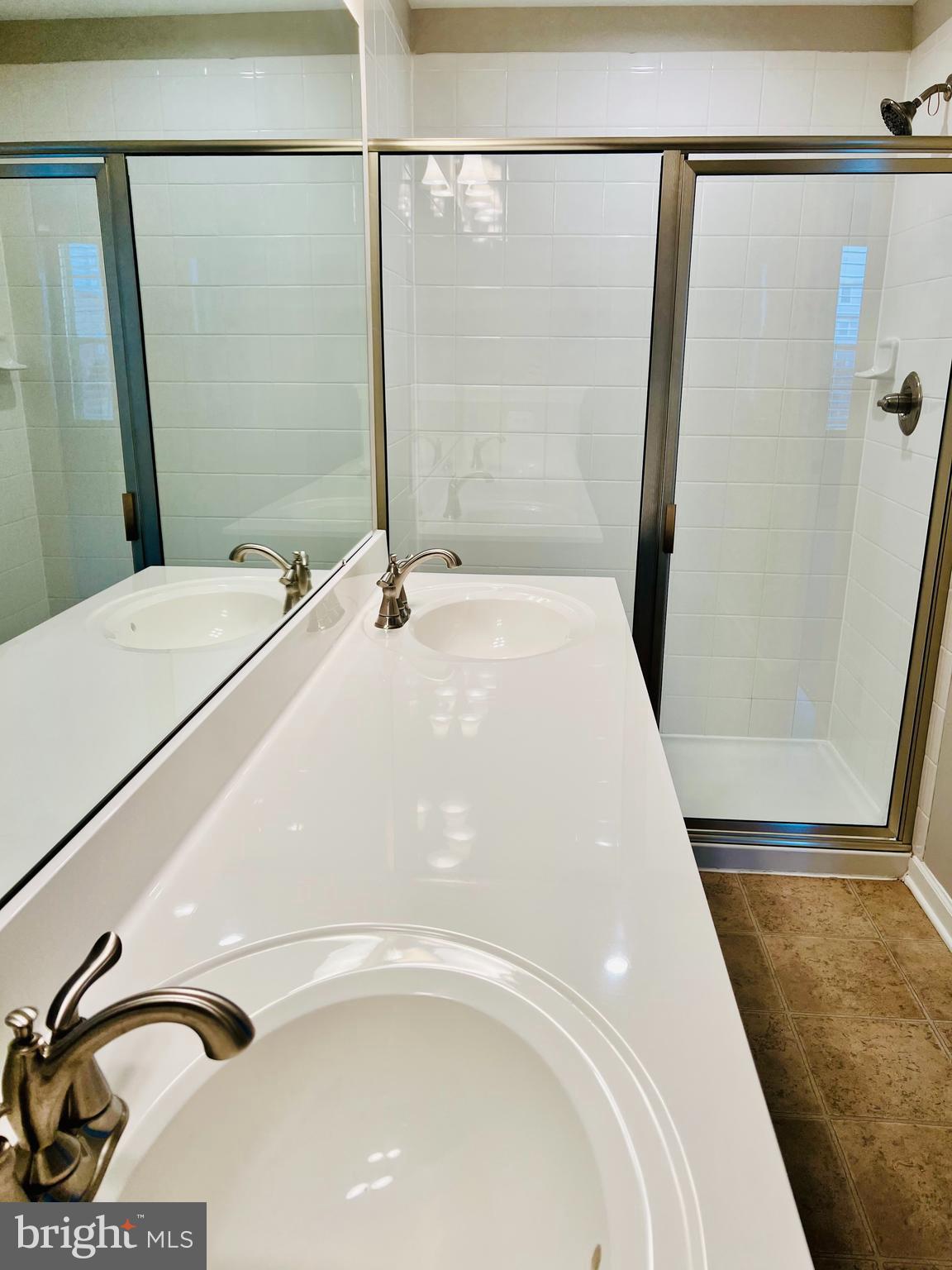 6508 Walcott Lane Frederick, MD 21703 - Photo 14 of 22 a bathroom with a sink and a mirror