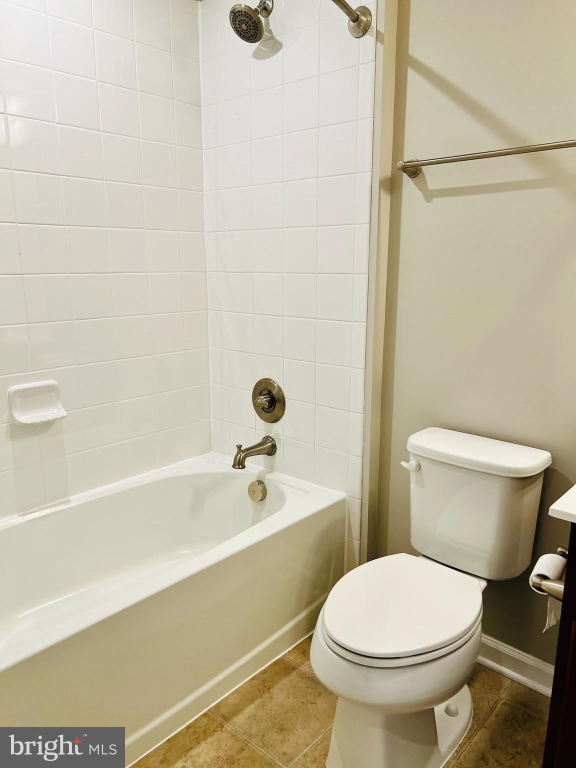 6508 Walcott Lane Frederick, MD 21703 - Photo 16 of 22 a bathroom with a toilet and a bathtub