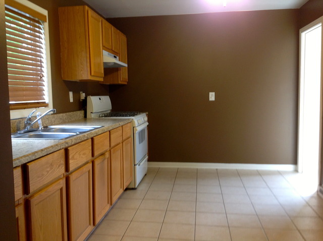 18904 Wolf Road Mokena, IL 60448 - Photo 4 of 10 a kitchen with a sink a cabinets and window