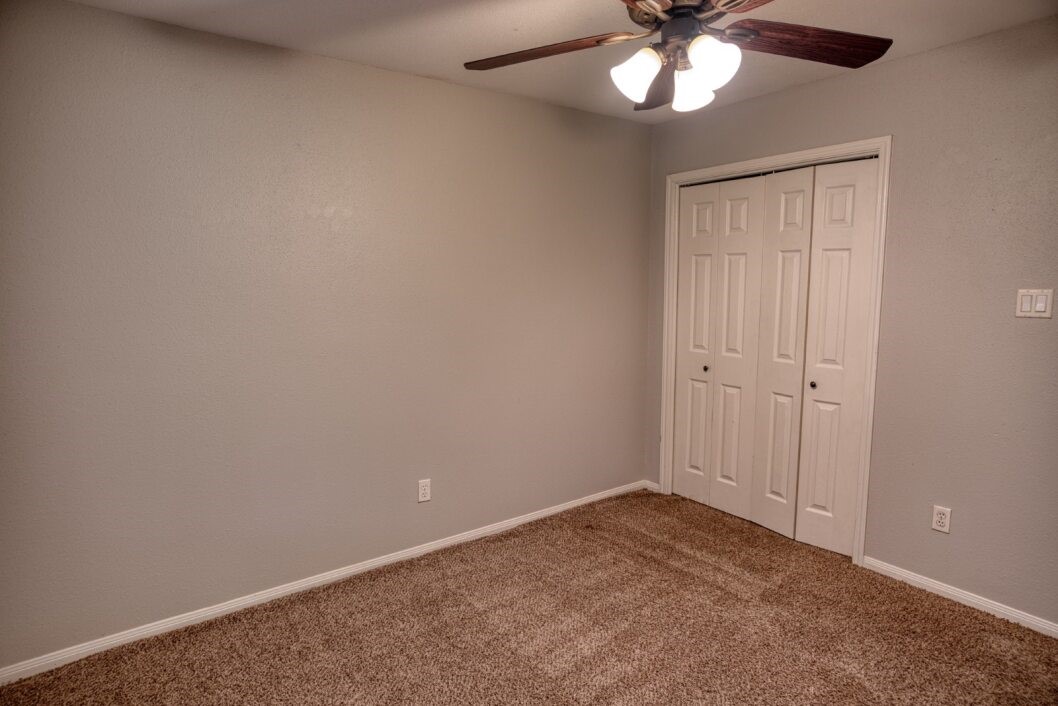 308 County Road 893B Angleton, TX 77515 - Photo 29 of 41 wooden floor in an empty room with a window
