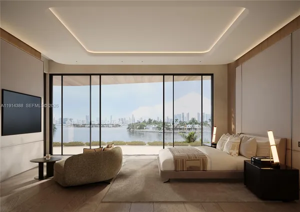 a living room with furniture and a floor to ceiling window