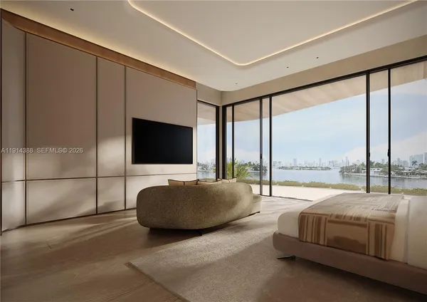 a living room with couch tv and a large window