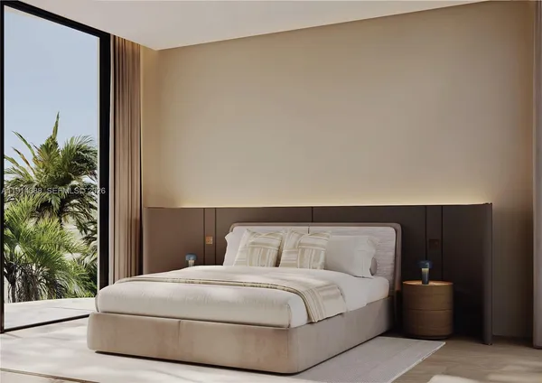 a bedroom with a bed and a potted plant