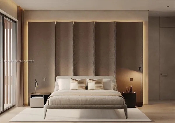 a bedroom with a bed and a lamp