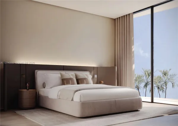 a bedroom with a bed and a potted plant