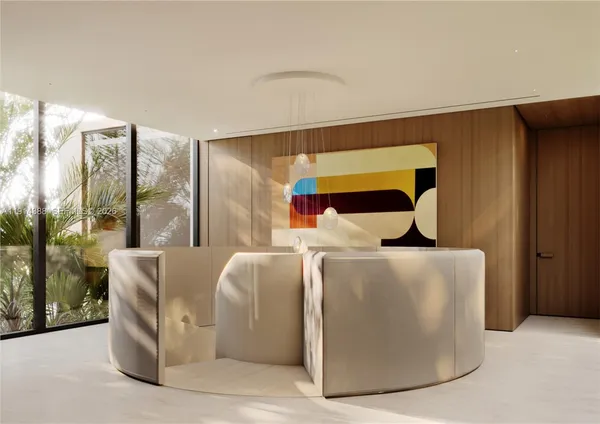 a living room with furniture and large windows