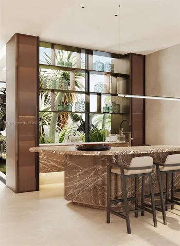 a living room with a large window and furniture