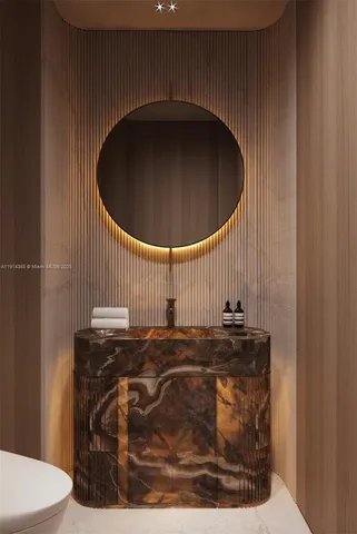 a bathroom with a sink and mirror