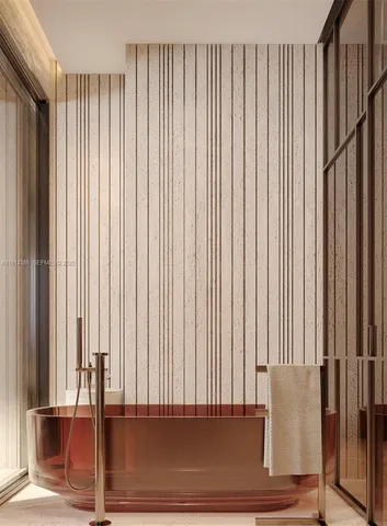 a bathroom with a tub and shower