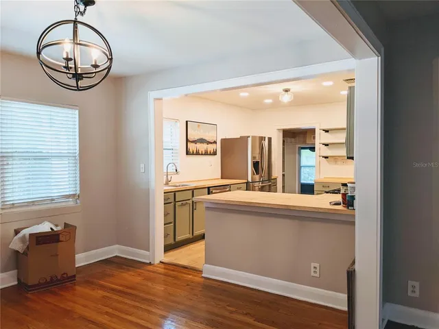 a kitchen with stainless steel appliances granite countertop a sink and cabinets