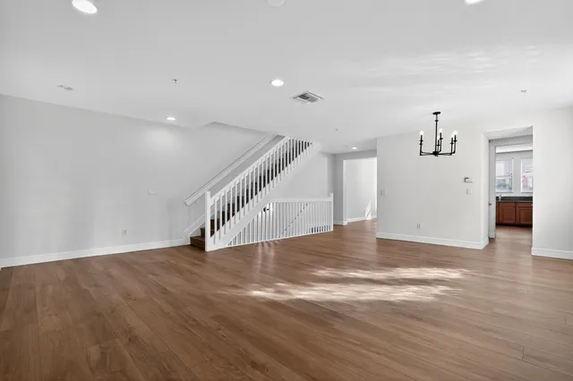 a bathroom with a double vanity sink toilet and a mirror