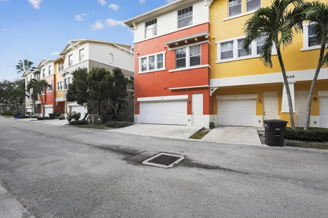 a kitchen with kitchen island granite countertop a stove and a sink