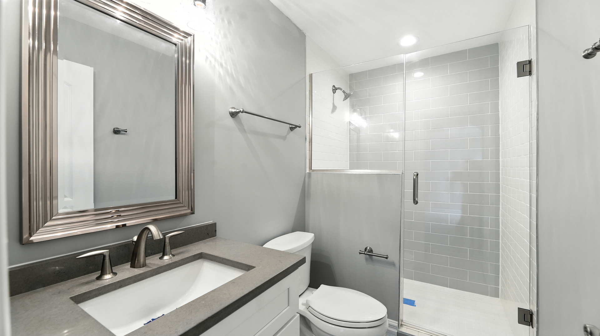 1127 Kenton Road Deerfield, IL 60015 - Photo 17 of 32 a bathroom with a sink a toilet and shower