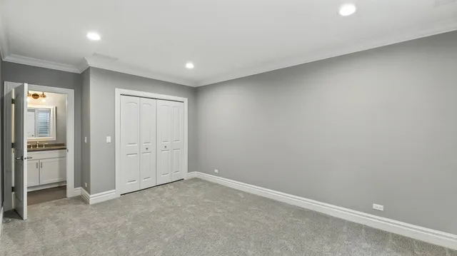 an empty room with closet area