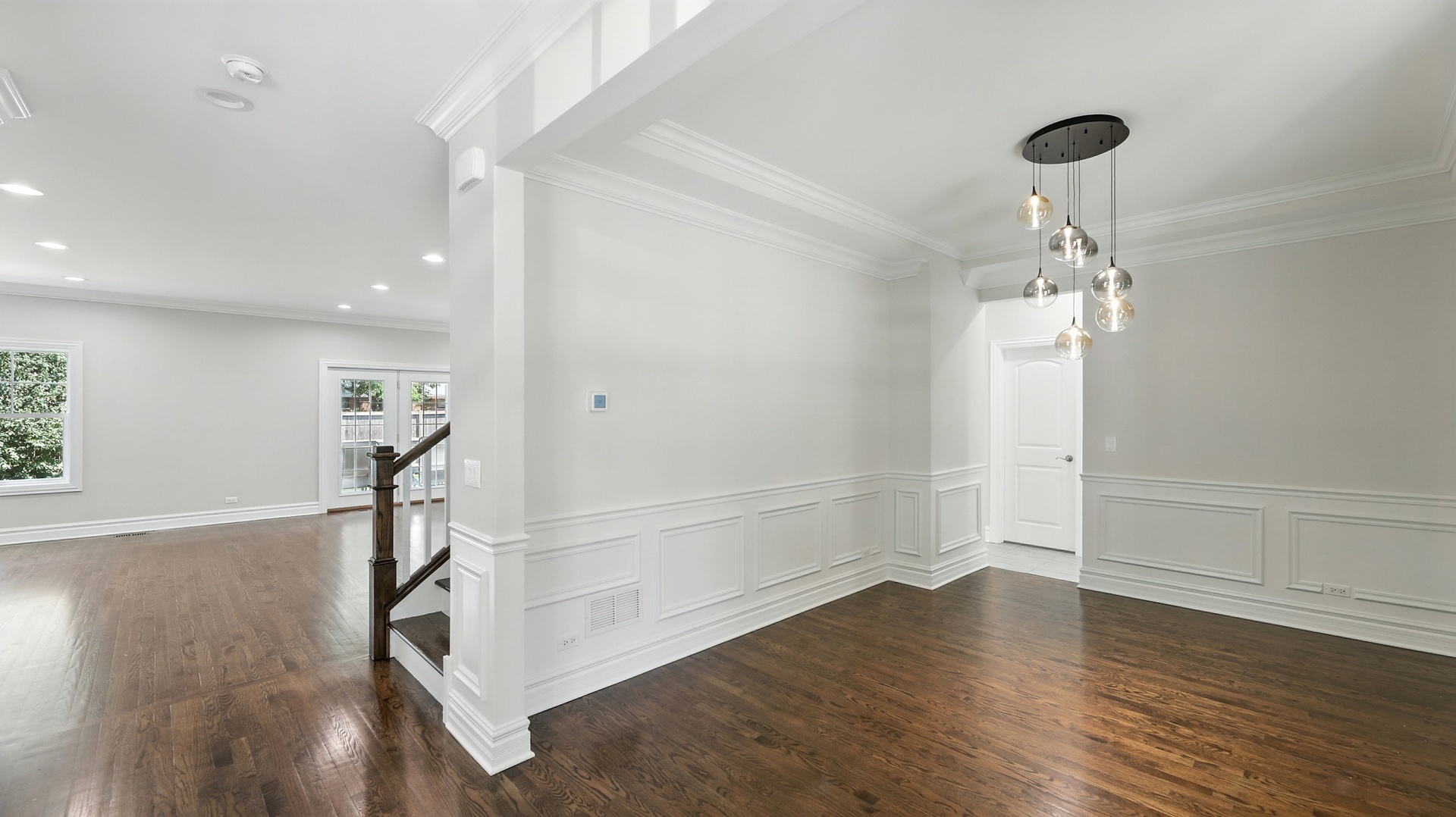 1127 Kenton Road Deerfield, IL 60015 - Photo 4 of 32 a view of a hallway with wooden floor and staircase