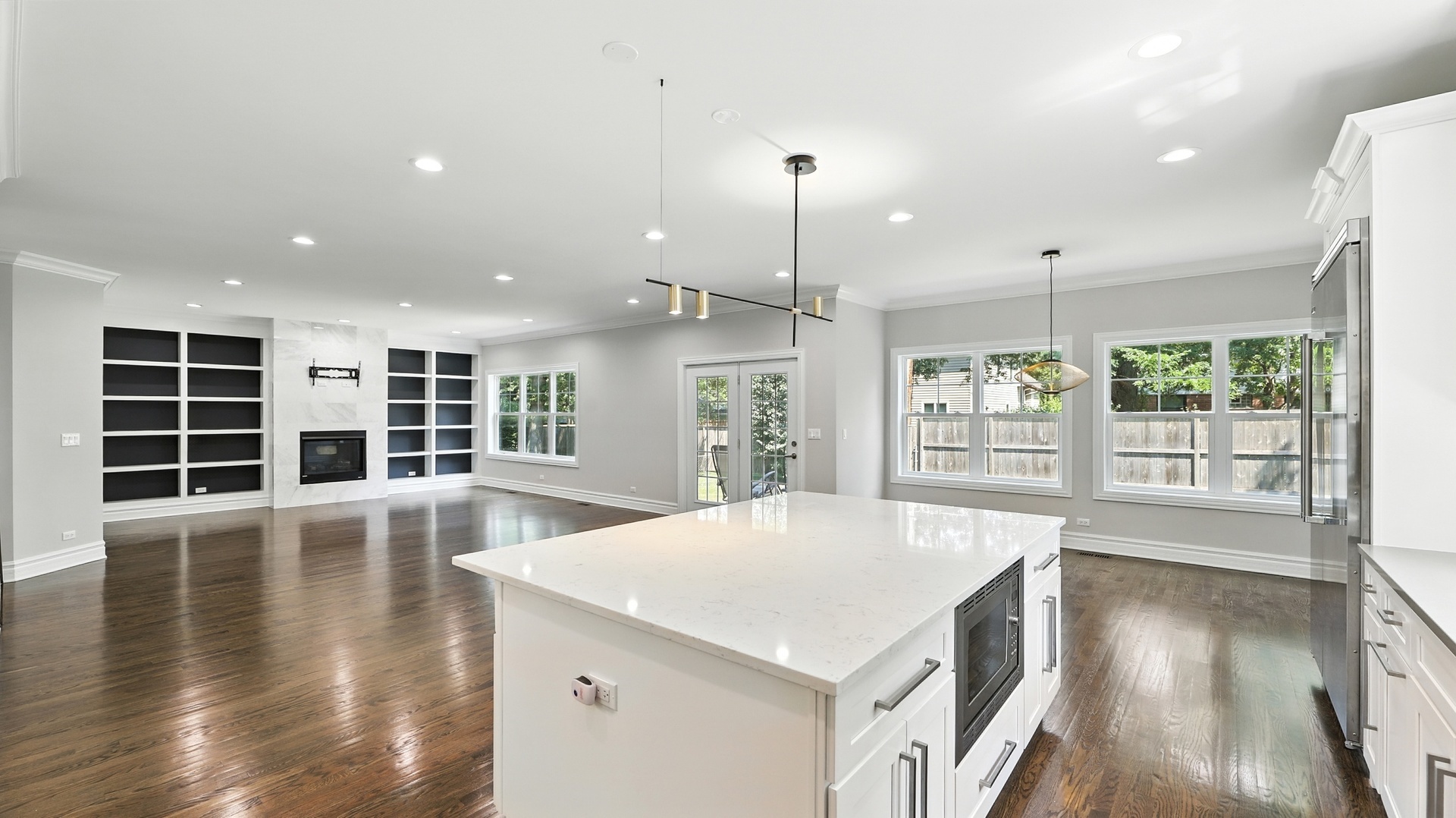 1127 Kenton Road Deerfield, IL 60015 - Photo 9 of 32 a view of an empty room with wooden floor and a window