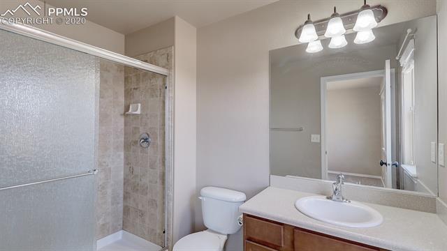 2316 Rusty Ridge Court Colorado Springs, CO 80921 - Photo 37 of 46 Upstairs Bedroom 3 on suite bathroom