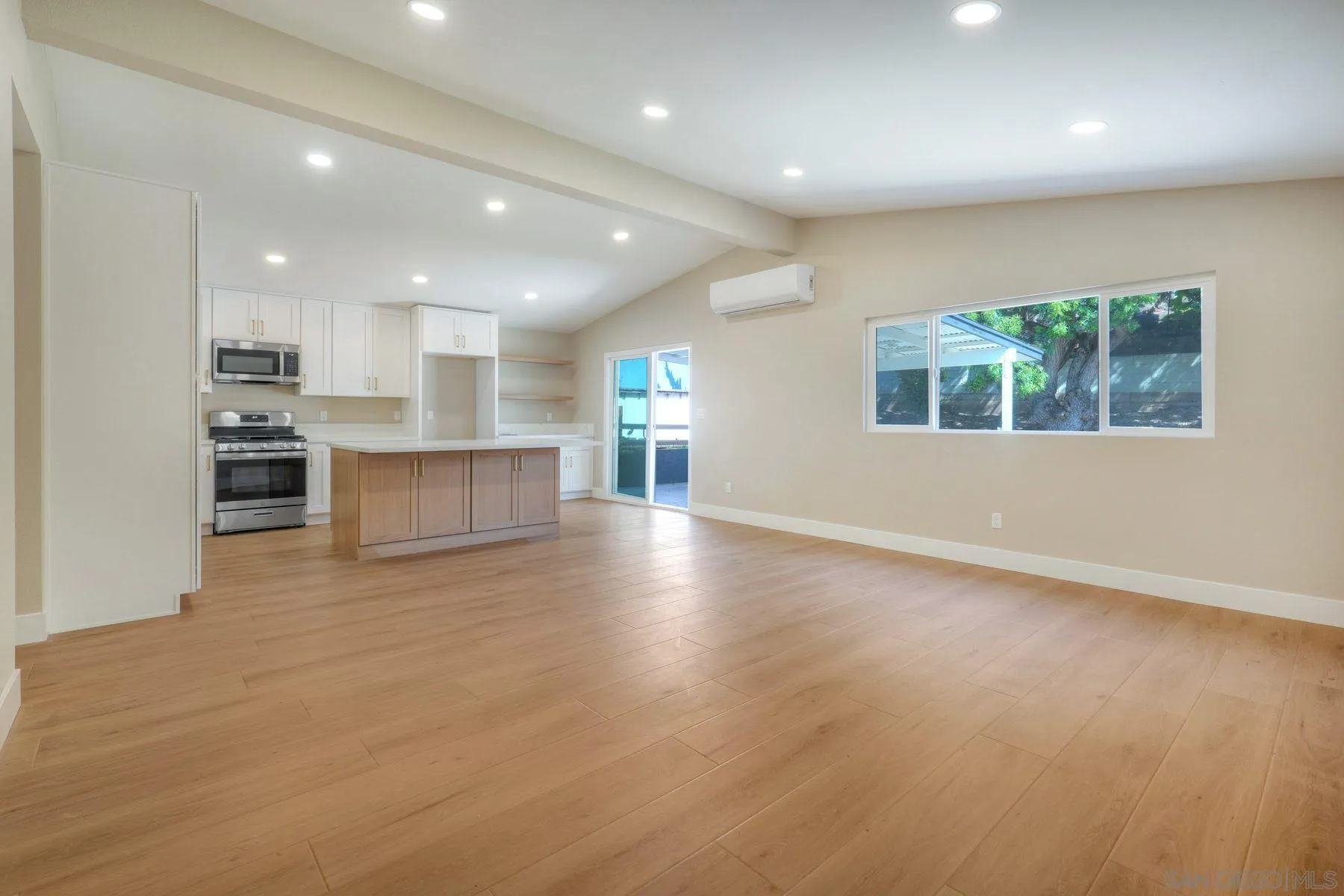 578 East Indian Rock Road Vista, CA 92084 - Photo 3 of 30 an empty room with wooden floor and windows