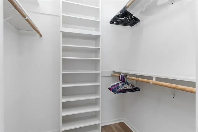 an aerial view of a house with outdoor space and swimming pool