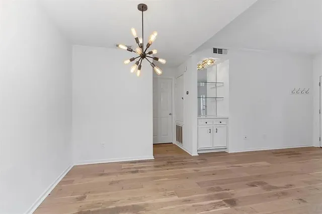a view of a livingroom with wooden floor