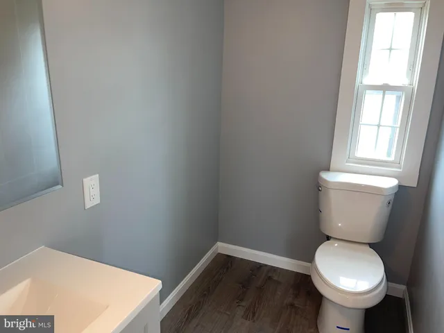 a bathroom with a toilet and a sink