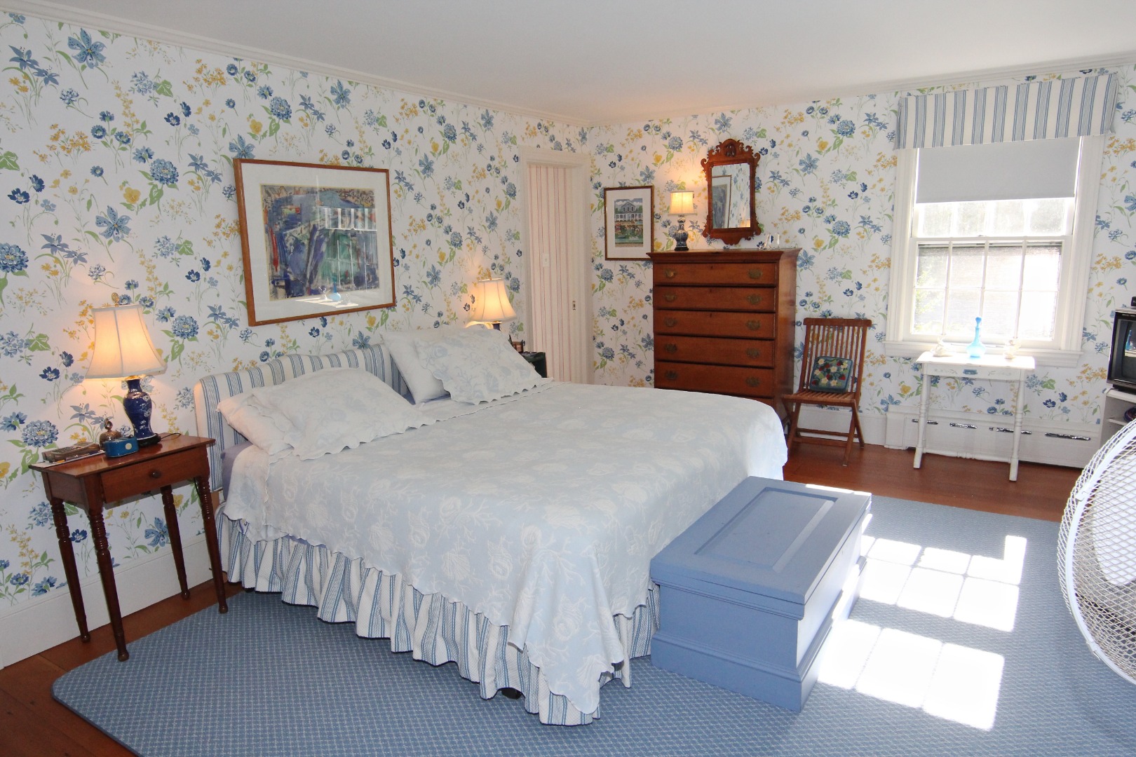 7 Green Hollow Road Edgartown, MA 02539 - Photo 22 of 53 a bedroom with a bed and a dresser with wooden floor