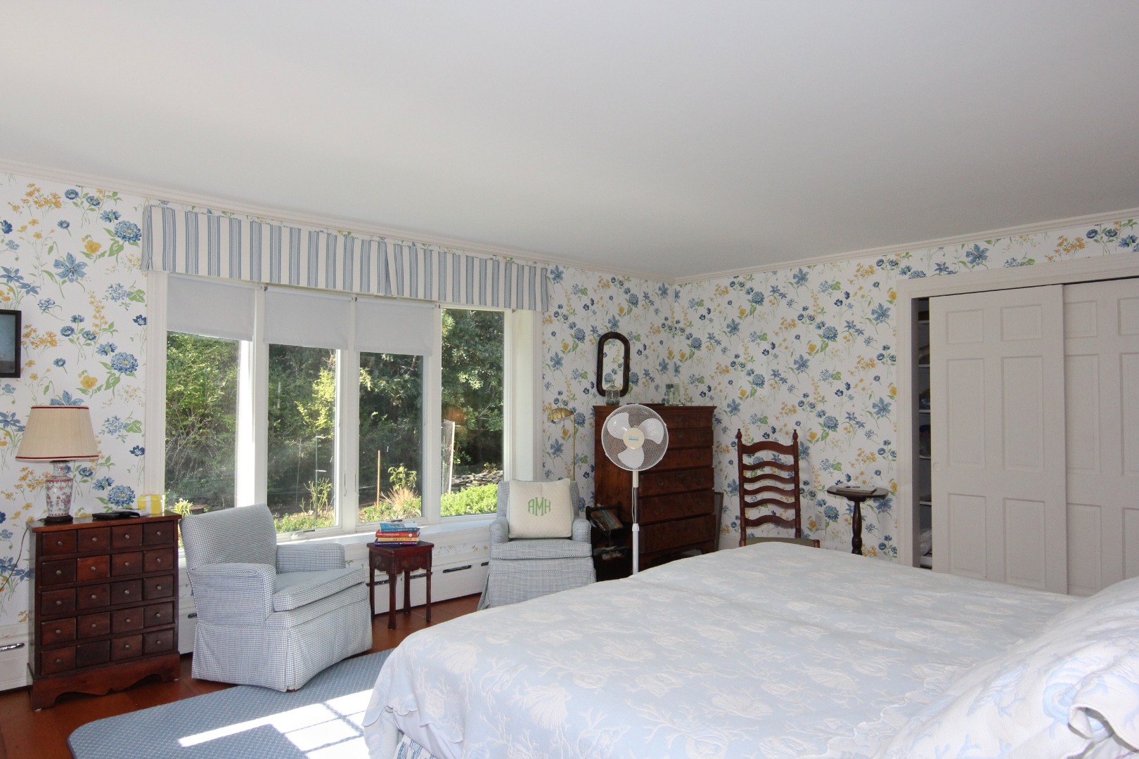 7 Green Hollow Road Edgartown, MA 02539 - Photo 23 of 53 a bedroom with a bed and a large window with the outer view