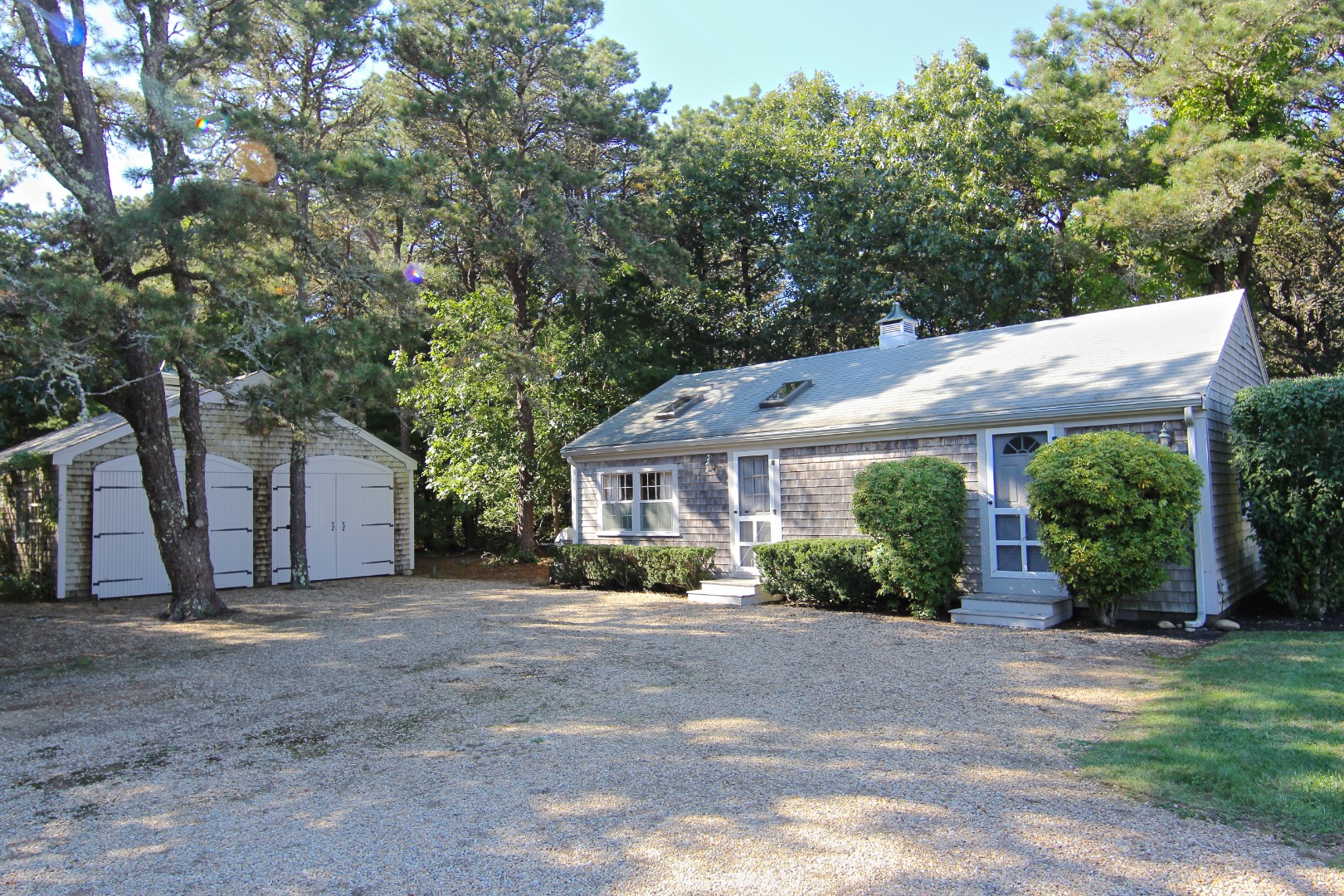 7 Green Hollow Road Edgartown, MA 02539 - Photo 42 of 53 a view of a house with garden and large trees