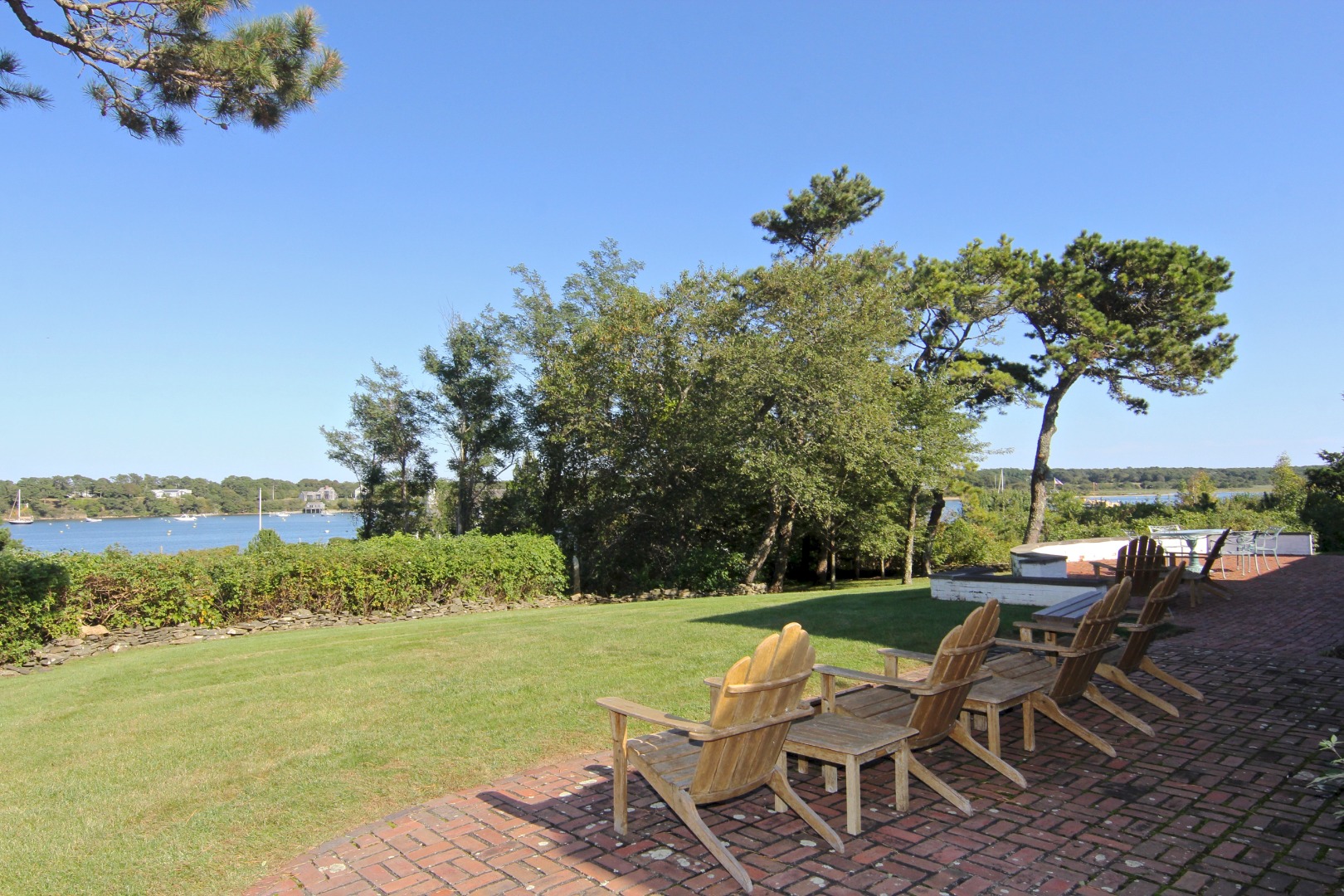 7 Green Hollow Road Edgartown, MA 02539 - Photo 8 of 53 a view of a chairs and table in the patio