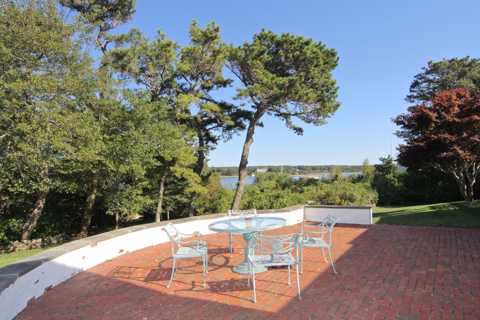 7 Green Hollow Road Edgartown, MA 02539 - Photo 9 of 53 a view of a swimming pool with a patio